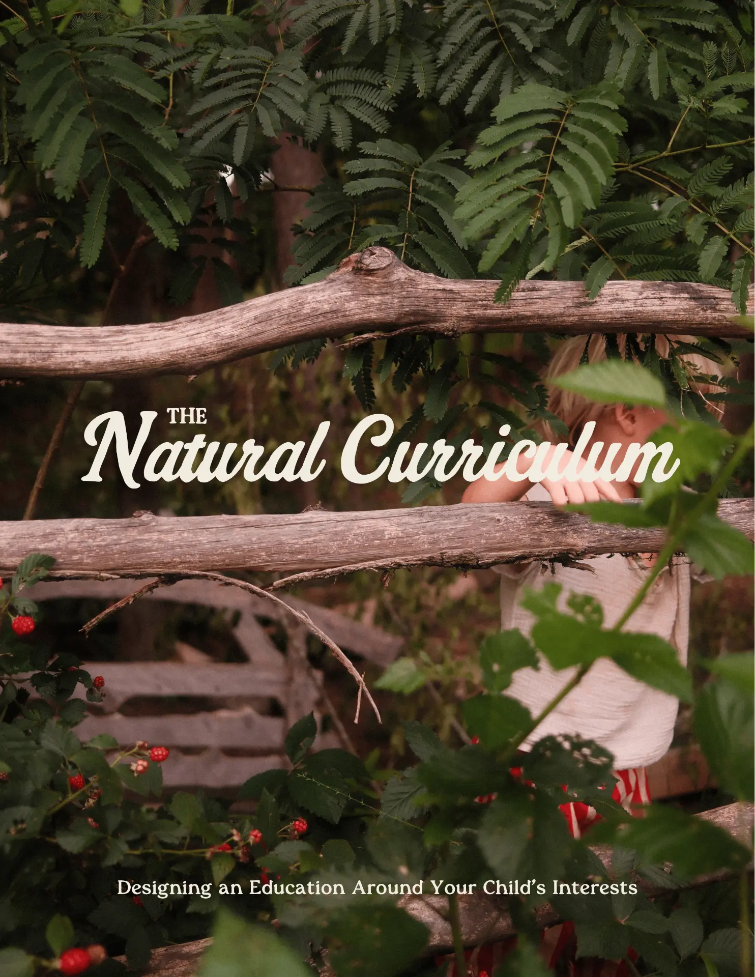 Cover of The Natural Learning Handbook: a child behind a rustic wooden fence in a green, berry-filled garden